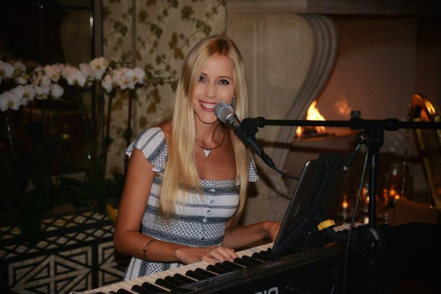 Joanna Holstein performing at a corporate reception
